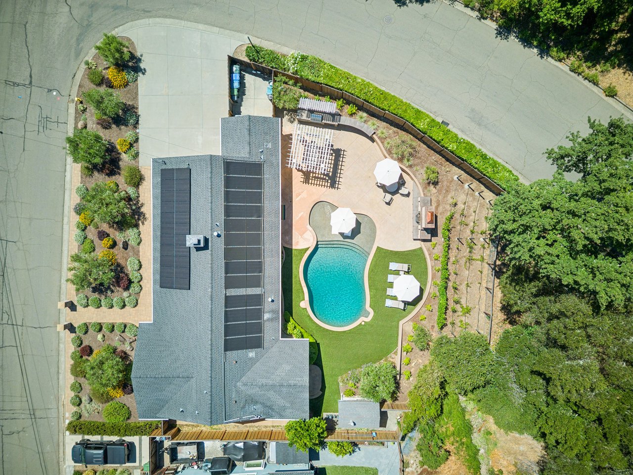 Direct overhead drone image of luxury home with pool in in Marin Country Club Estates