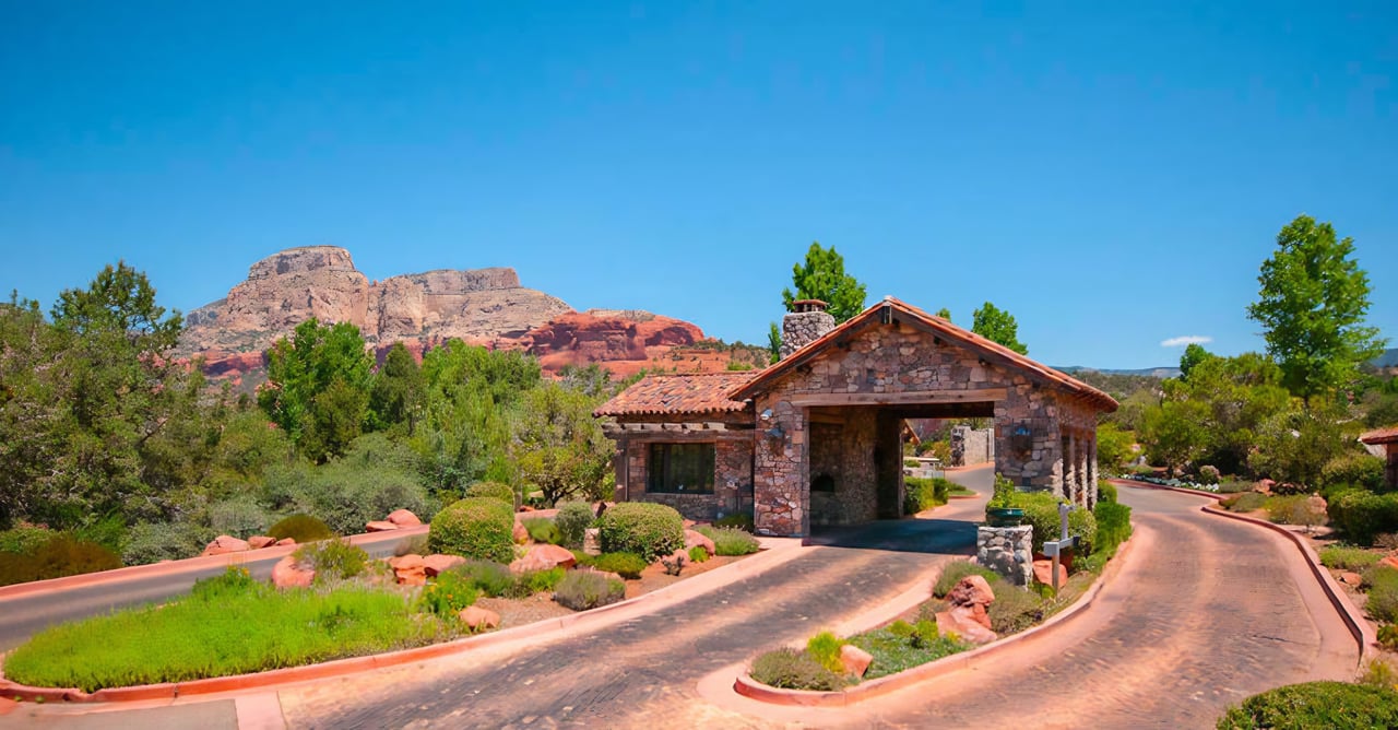 Elegant gated entrance framed by Sedona Red Rocks