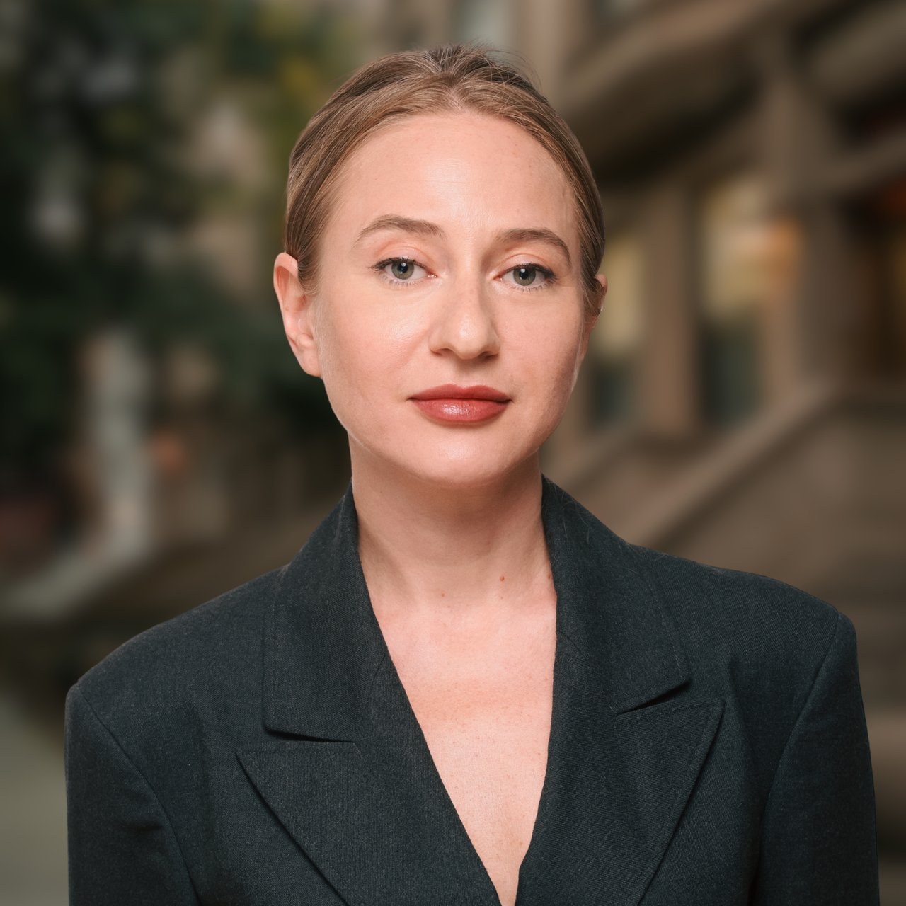 Marita Khinchigashvili in a dark blazer against a softly blurred interior.