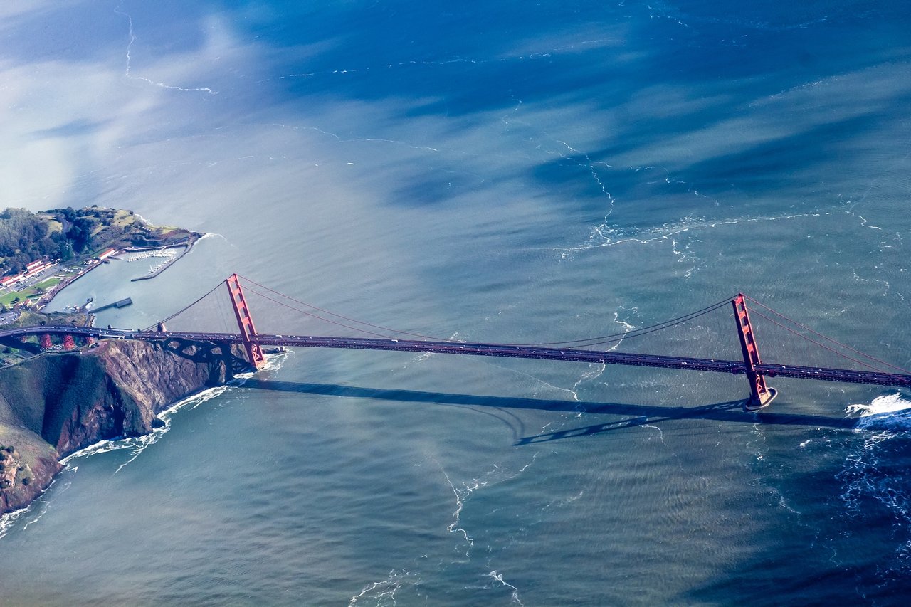 Aerial view of the Golden Gate Bridge representing the competitive San Francisco and Marin housing markets where bidding wars are common.
