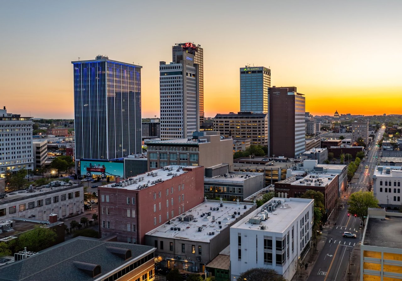 Downtown Little Rock skyline at sunset, with the Regions tower and city streets.