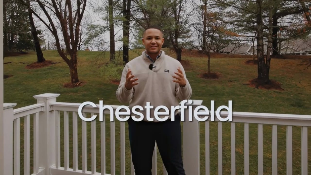 A. J. Graham speaks on a white-railed deck in Chesterfield.