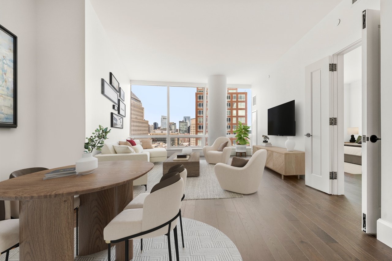 Open-plan living and dining area with floor-to-ceiling windows overlooking the city skyline.