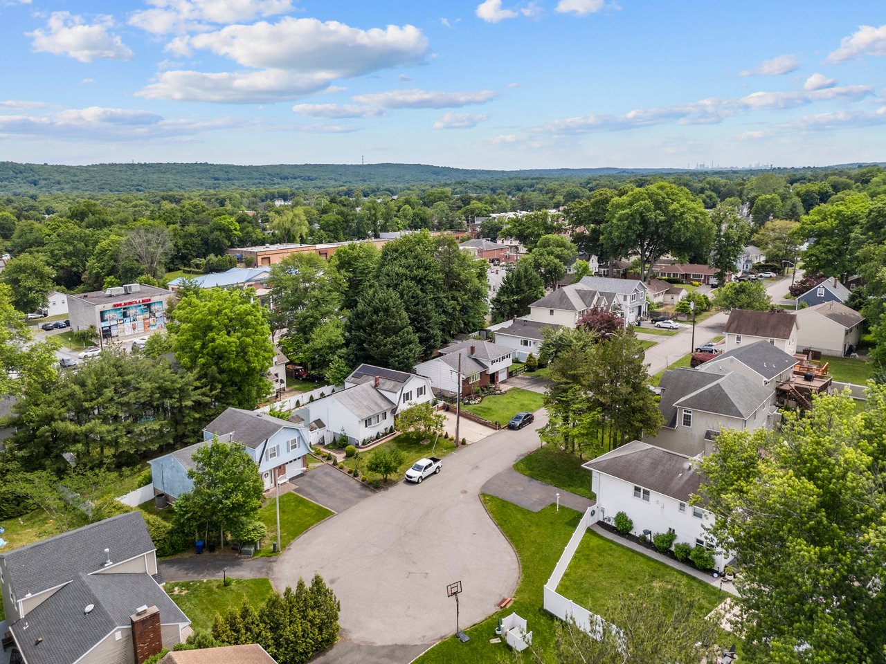 Aerial view of 322 Scharer Ave, Northvale, NJ, showcasing the cul-de-sac location and property exterior.