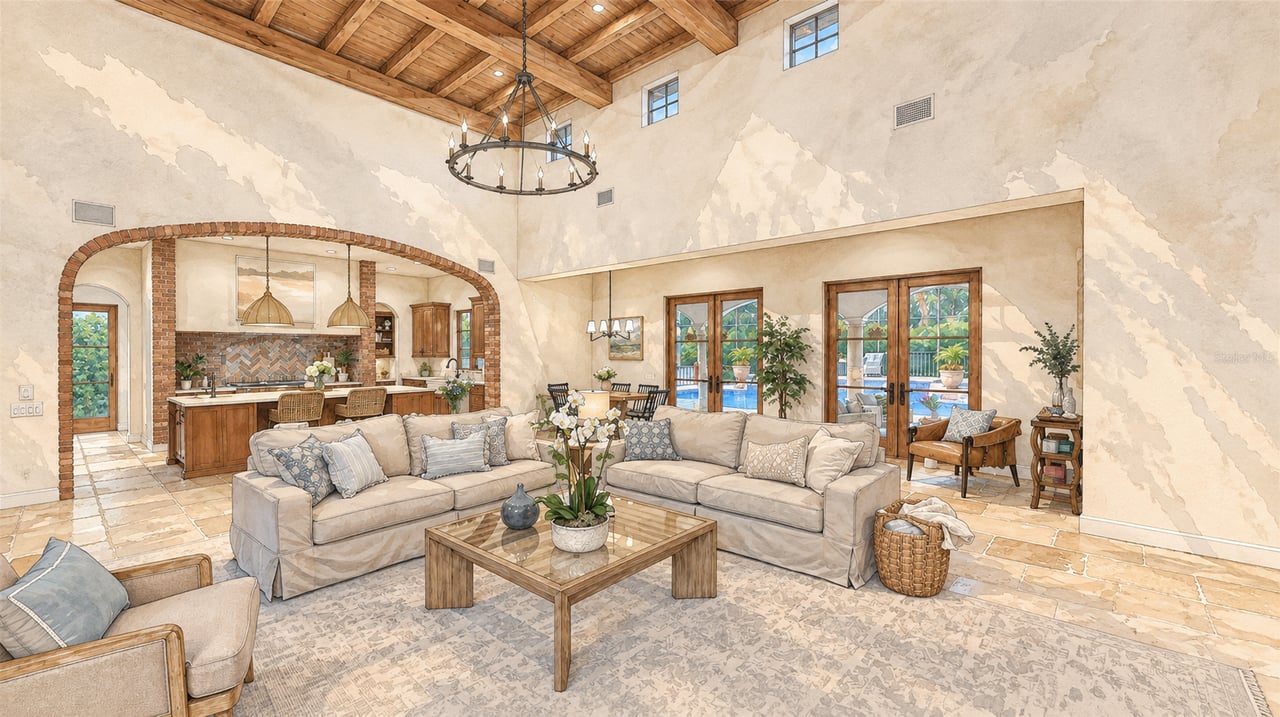 Vaulted living room with a wood-beam ceiling, brick-trimmed kitchen arch, and glass doors overlooking a pool.