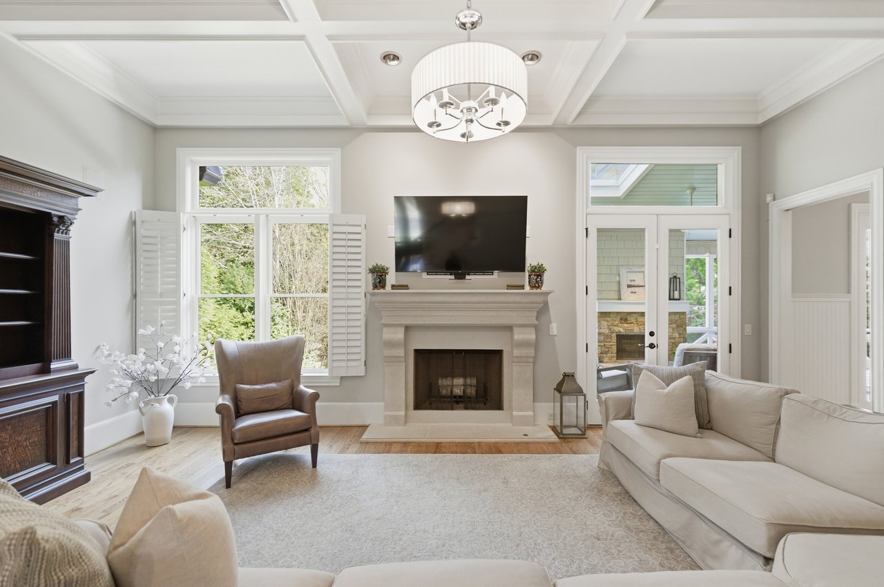 Bright open concept living room in East Cobb home with natural light and elegant finishes