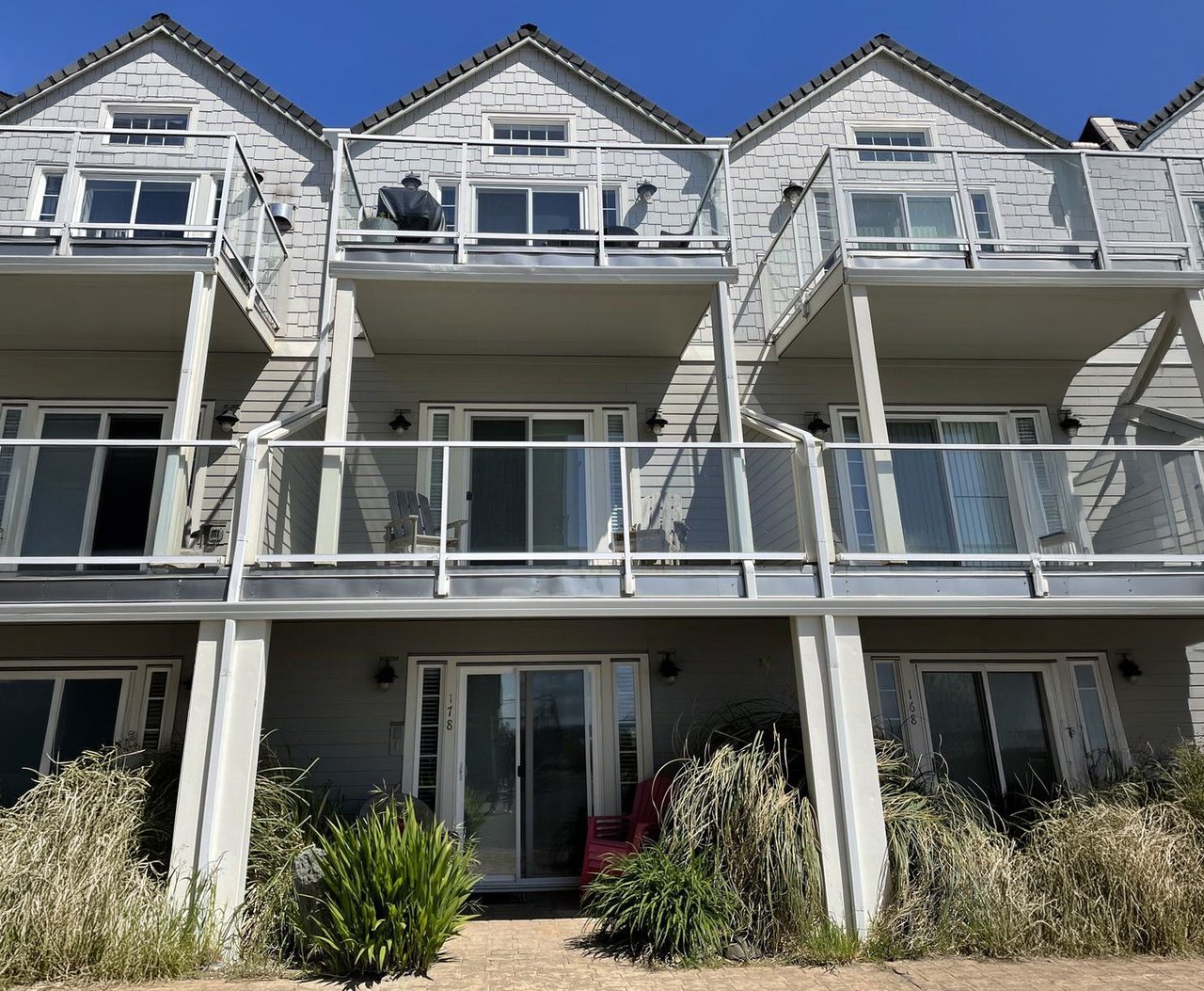 Sold Rockaway Beach townhouse at 178 North Pacific St, represented by Erin Laskey of Home + Sea Realty, with three levels, garage parking, and beach access nearby.