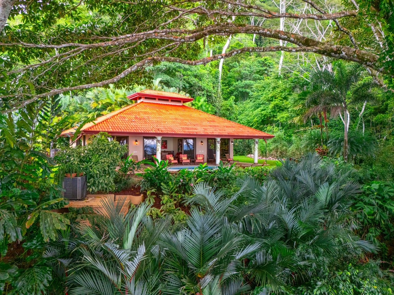 Ocean, jungle & mountain views on a meticulously landscaped 3-home family compound