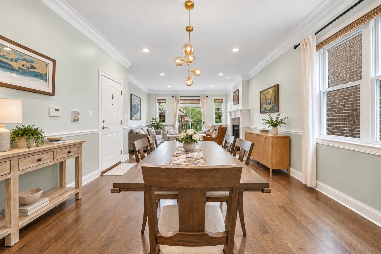 Dining room with crown molding, open to the living room