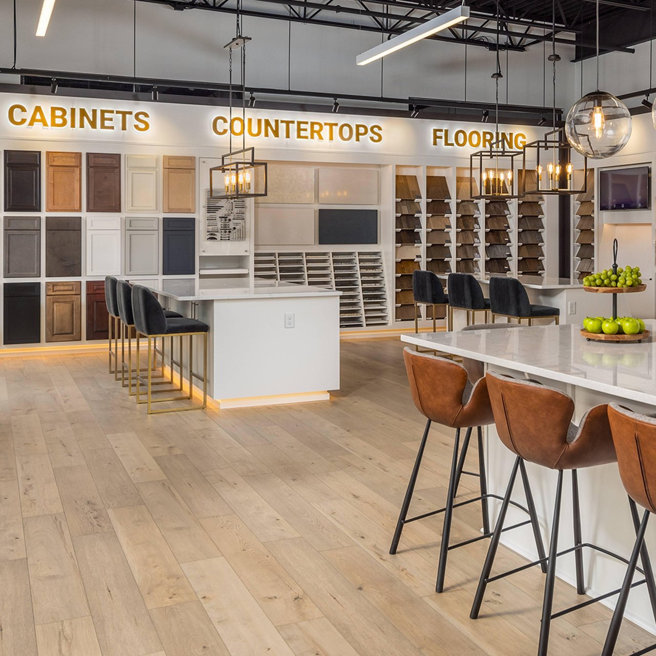 Home-finish showroom with cabinet samples, countertop displays, and flooring options.