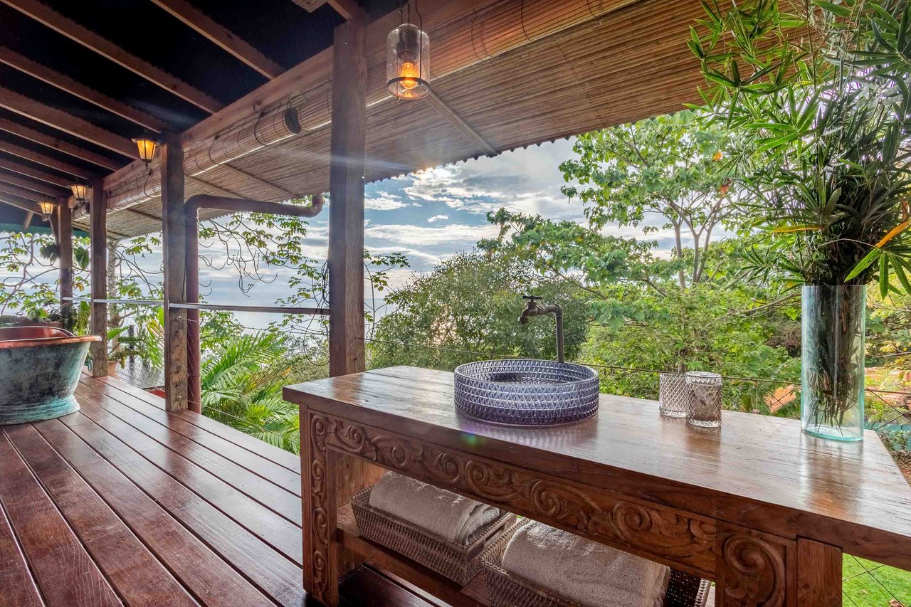 A Handcrafted Residence Immersed in Nature Above the Canopy Ocean View Architectural Home