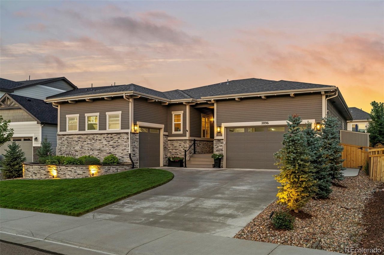 Modern ranch-style home at 2896 Keepsake Way in Castle Rock, Colorado, with clean exterior lines, manicured landscaping, and inviting curb appeal.