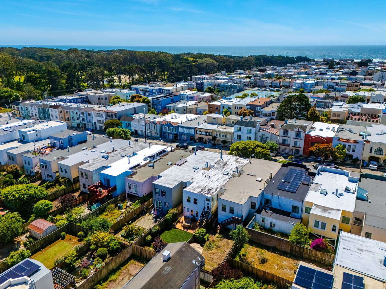 Aerial view of San Francisco's Outer Richmond neighborhood looking south across the residential avenues of pre-war flats and single-family homes toward Golden Gate Park.