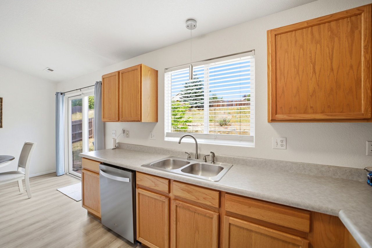 Kitchen with window over the sink and view to the dining area