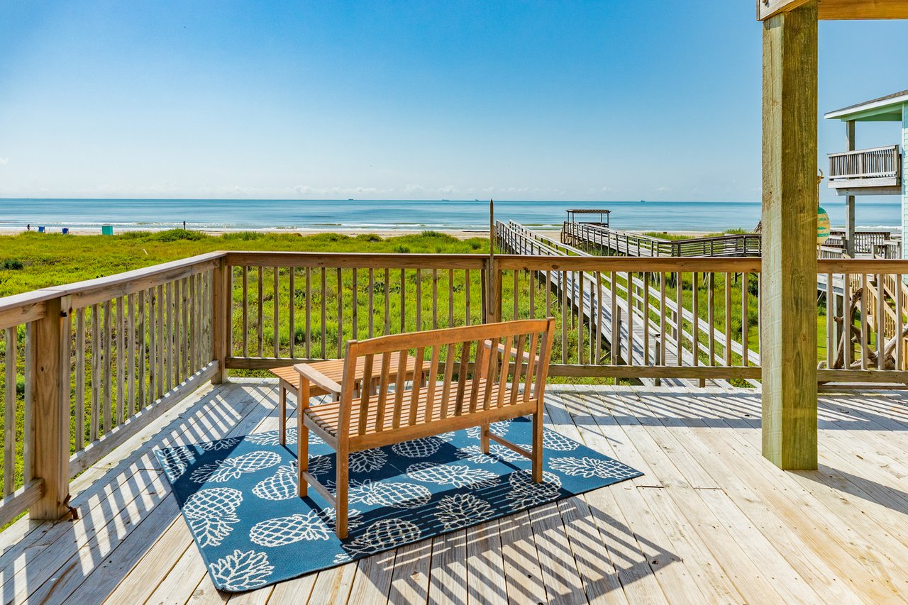 View from the beachfront deck at 2032 Blue Water Hwy #257 in Surfside Beach, TX, featuring a bench overlooking the Gulf