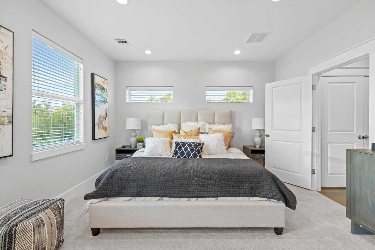 master bedroom with a king bed 