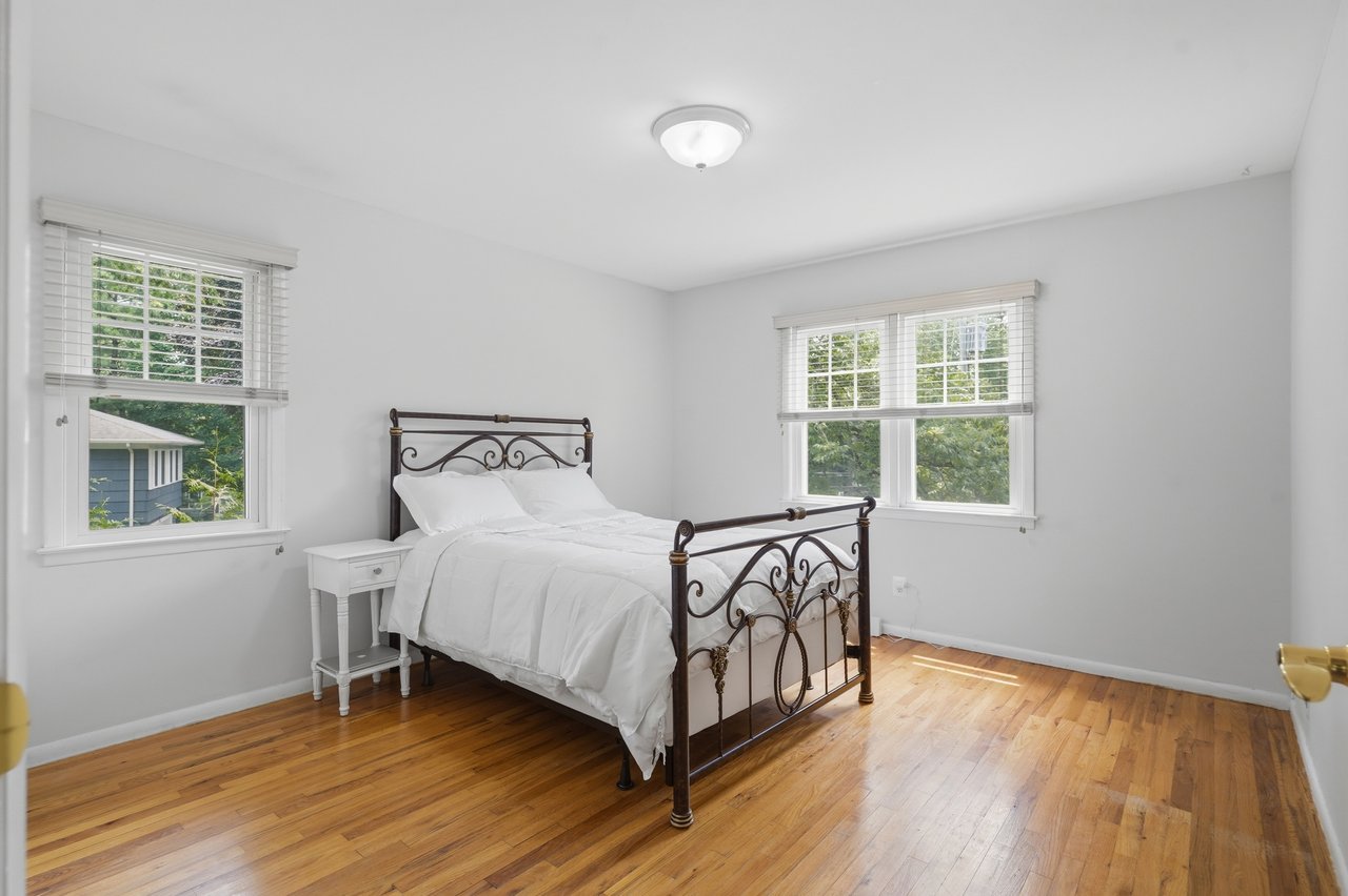 Bedroom with multiple windows