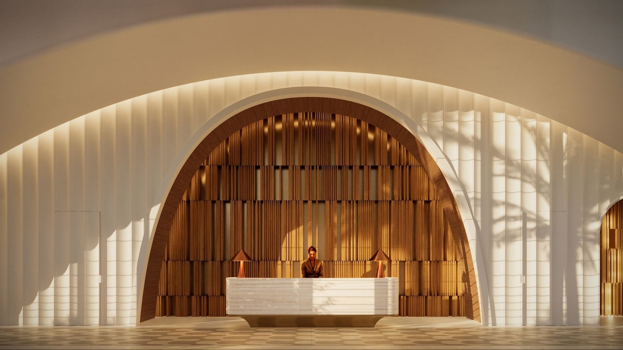 Lobby reception desk beneath a monumental wood-slat arch at The Ritz-Carlton Residences, South Beach.