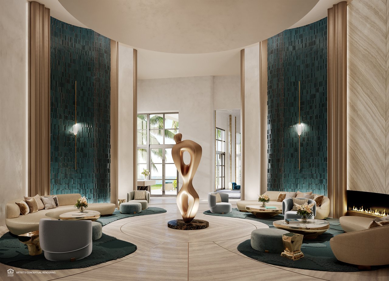 St. Regis lobby with tall teal tiled walls, a central sculpture, lounge seating, and a fireplace.