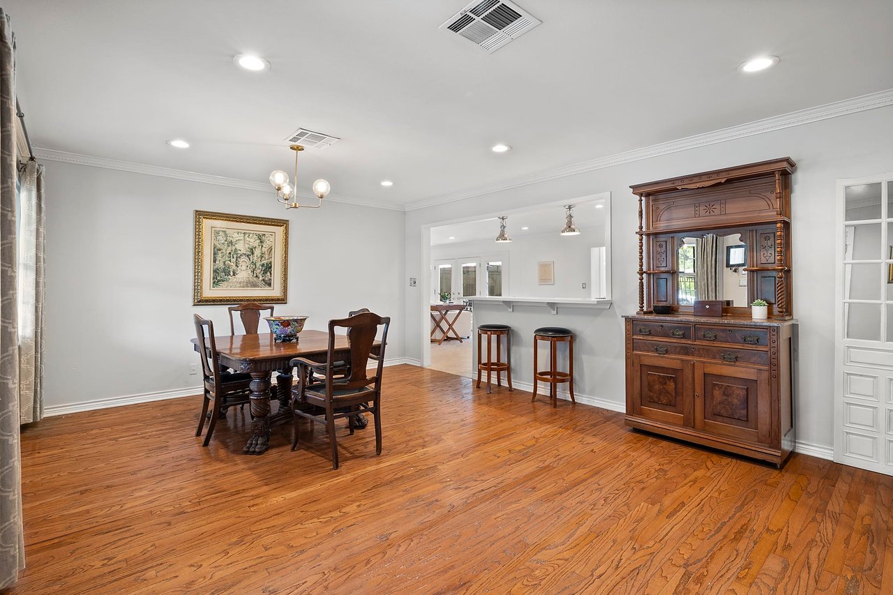 Dining room with original wood floors and a wood hutch cabinet, 2404 Westover Rd.