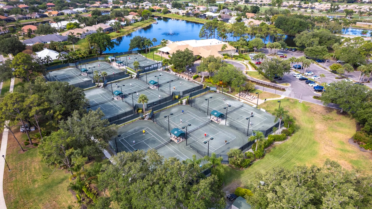 Aerial view of Har-Tru tennis courts at Longshore Lake community in Naples Florida
