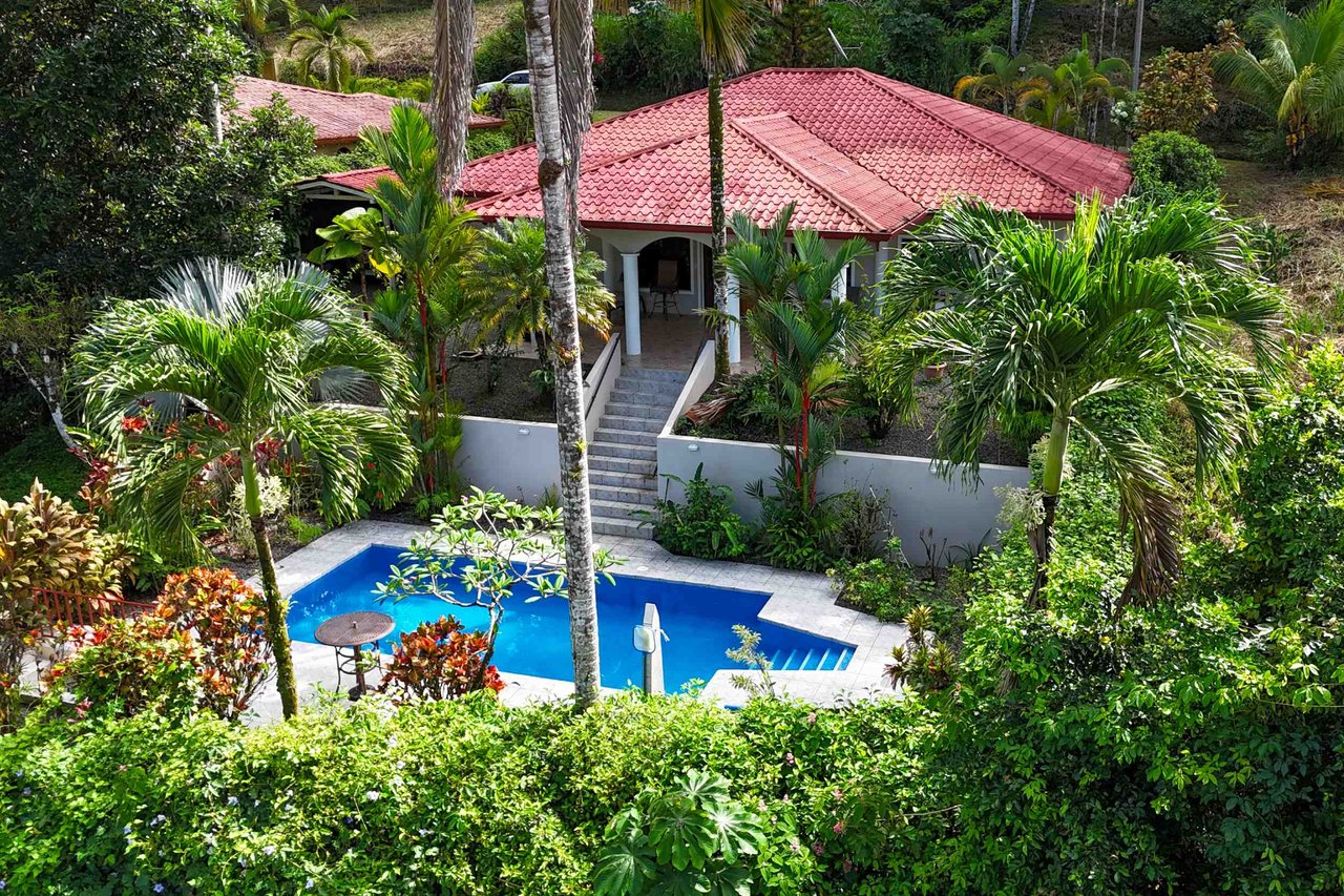 Turnkey Spacious Home with Open Layout, Pool & Small Ocean View in Ojochal Gated Community