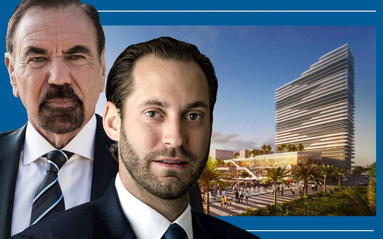 Two suited men in front of a rendering of a high-rise condo tower and landscaped plaza.