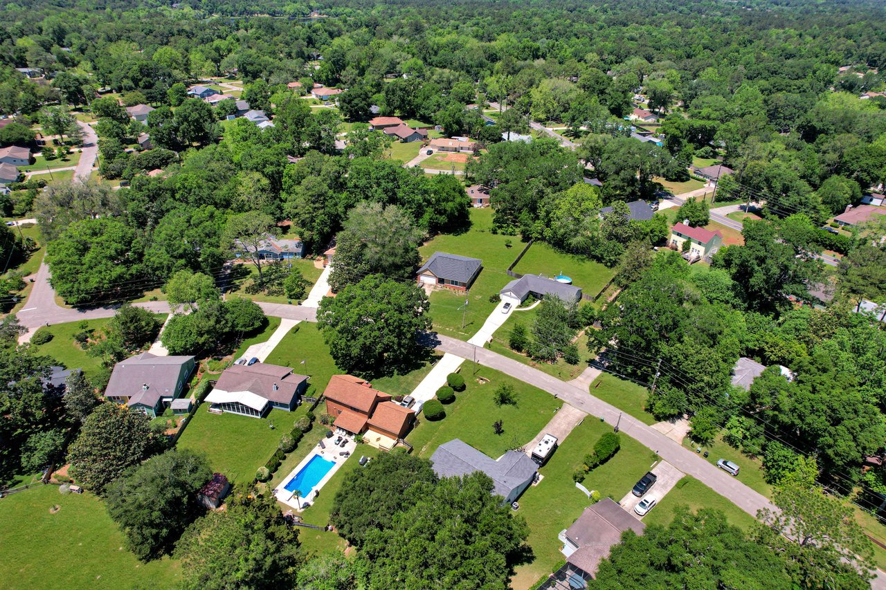 An aerial view of a different residential community, Killearn Acres, highlighting the houses and tree-lined streets.