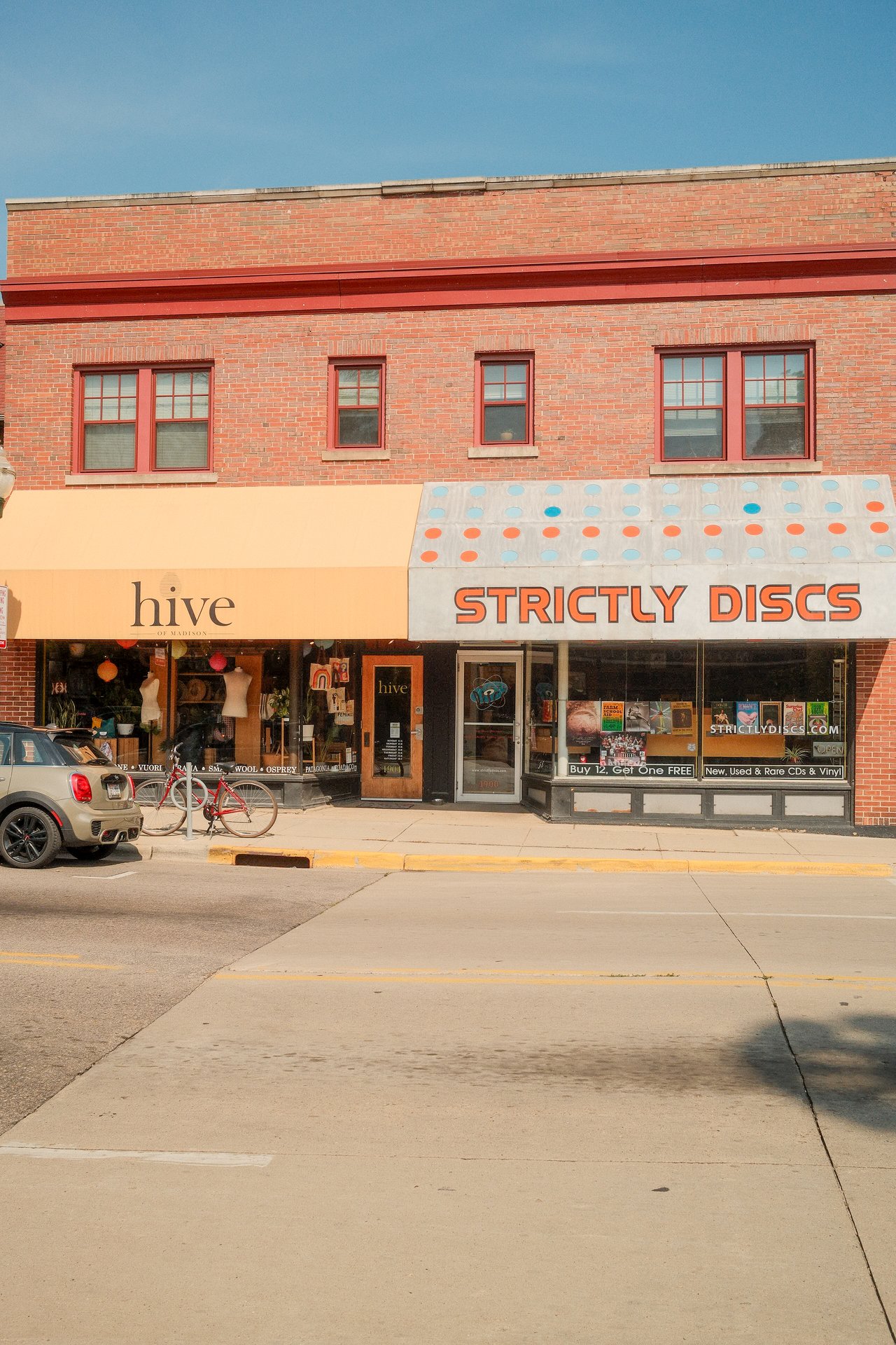 Strictly Discs and Hive storefronts along Monroe Street in Madison, Wisconsin