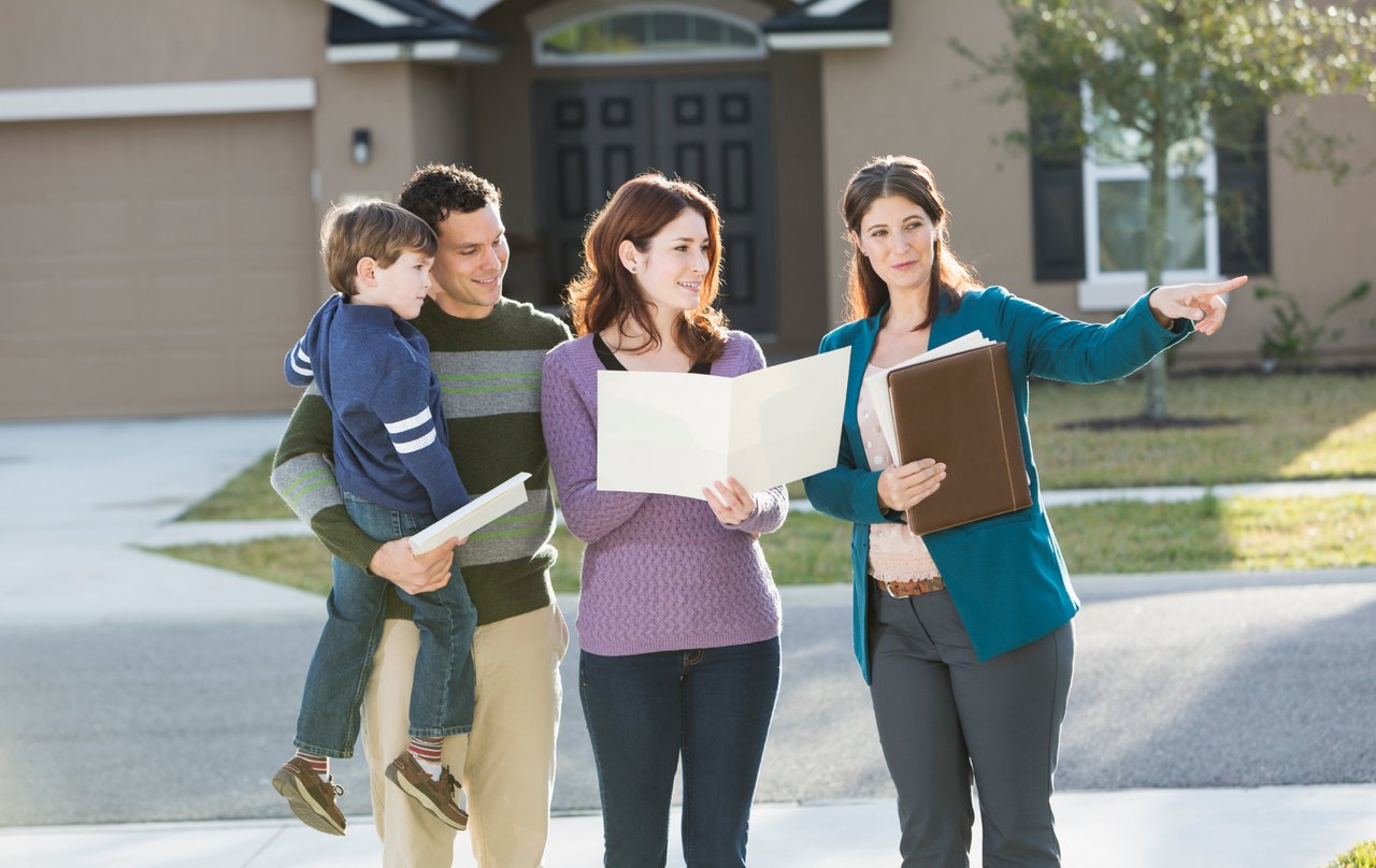 Denver homebuyers meeting with a real estate agent to start the homebuying process