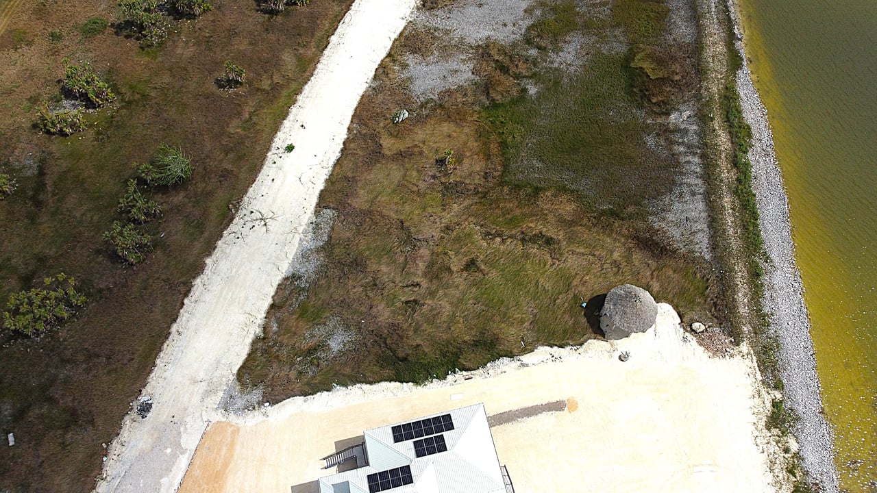 Vacant waterfront lot in a luxury master-planned gated residental community in northern Belize