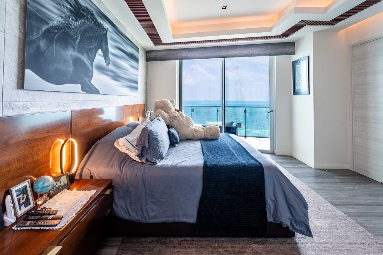 LUXURIOUS and STUNNING apartment featuring OCEAN VIEWS from the living room, primary bedroom, and terrace, with BEACHFRONT access in Cancun's most upscale area