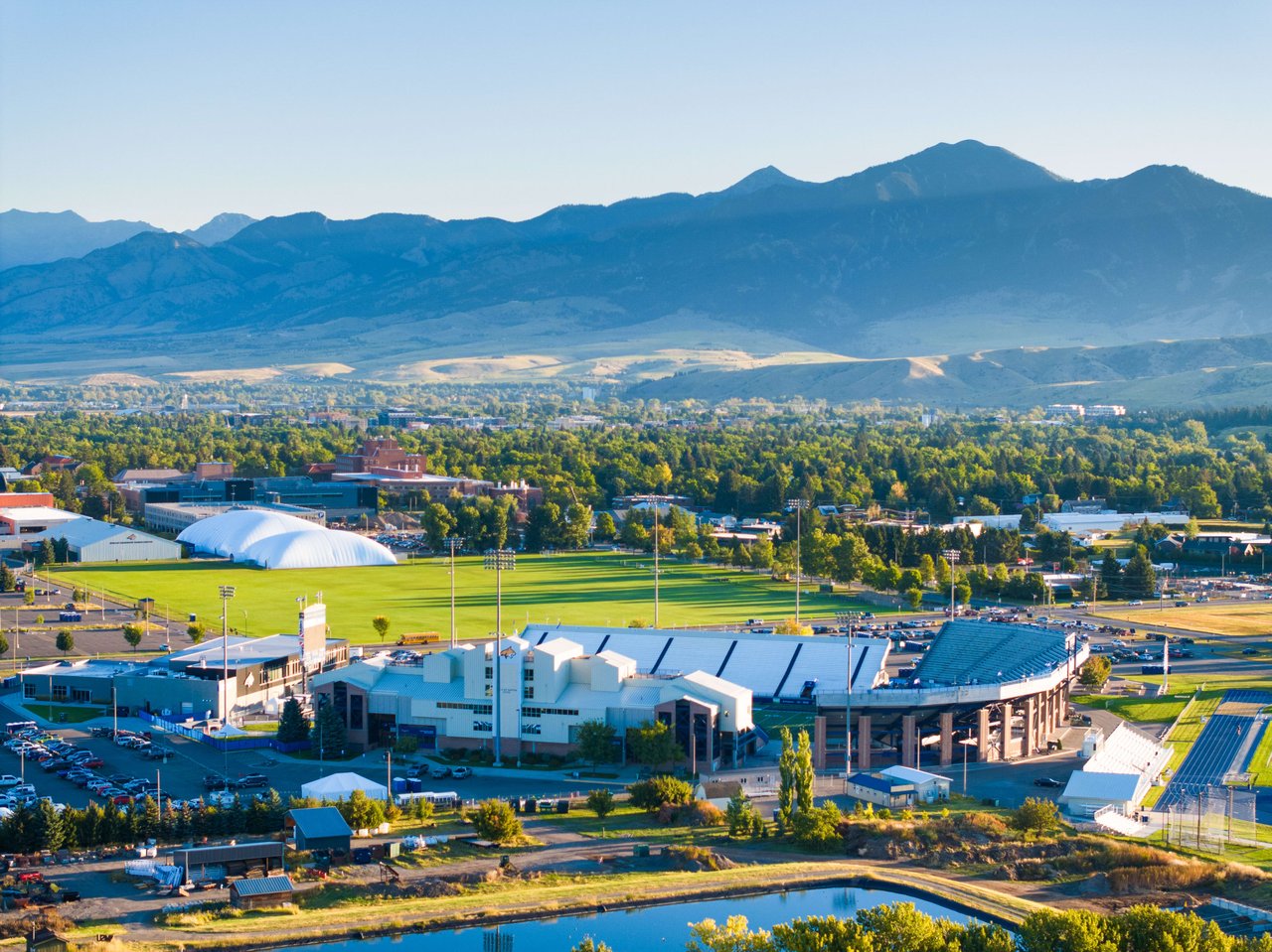 Aerial view of Bozeman, Montana overlooking Montana State Bobcat football stadium with view of the Bridger Mountain Range.