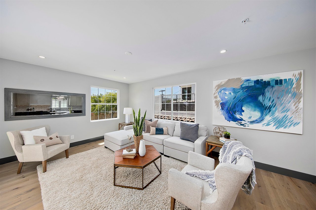 living room with blue art and neutral furniture in pacific beach san diego