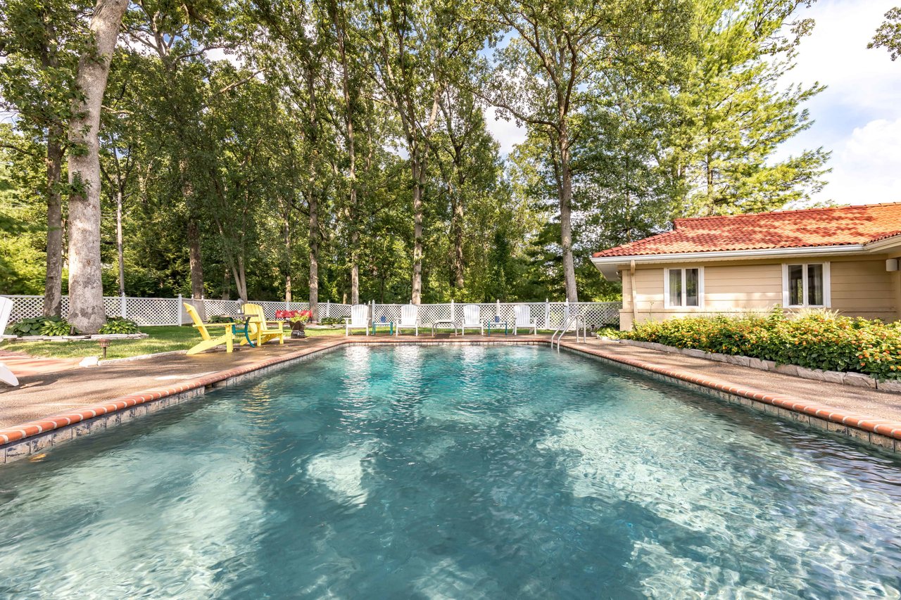 A Special Retreat on a Prized One Acre Lot With Pool and Tennis Court