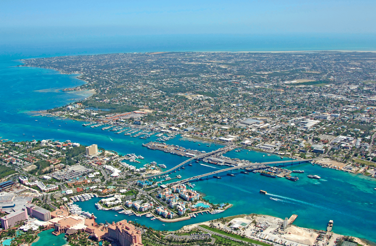 An aerial view of a city surrounded by water.