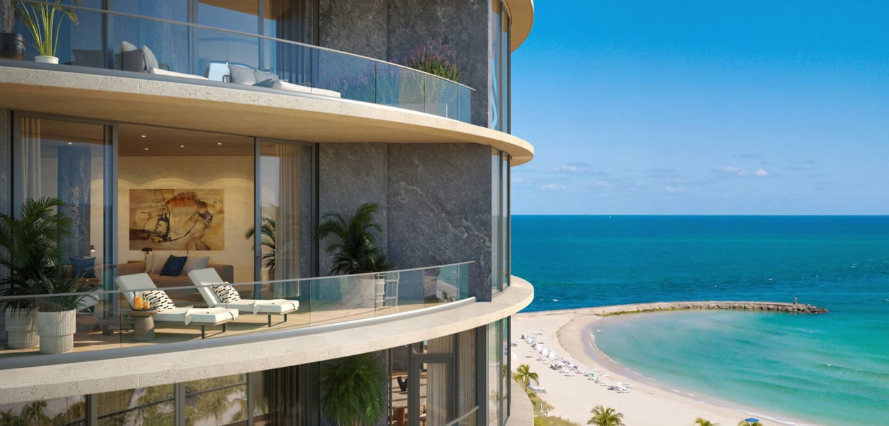 Curved glass-balcony residences overlook a turquoise beach and ocean at Rivage Bal Harbour.