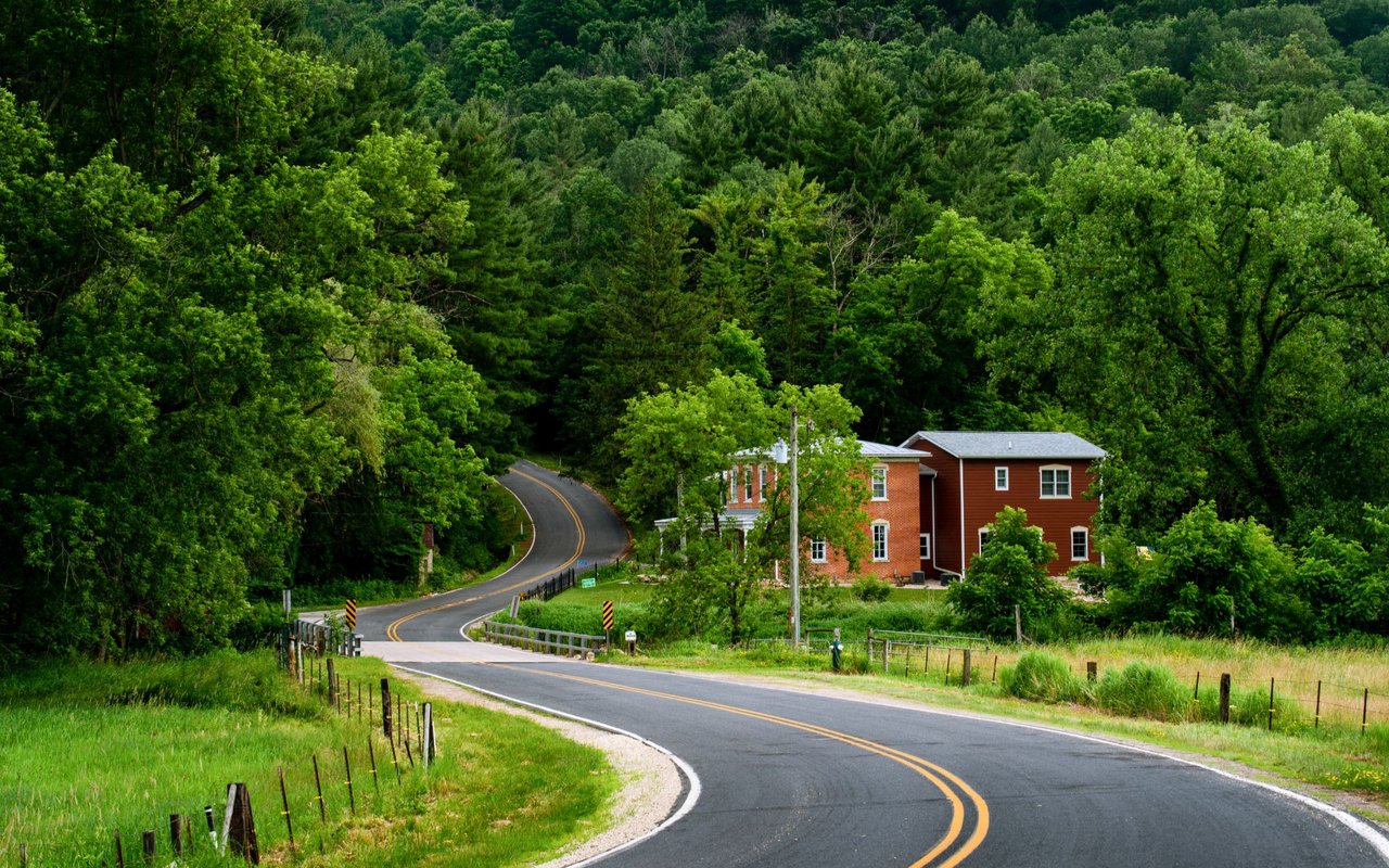 Scenic view of La Crosse County, Wisconsin, featuring the Mississippi River and surrounding bluffs, showcasing the natural beauty and vibrant communities of the Driftless Region.