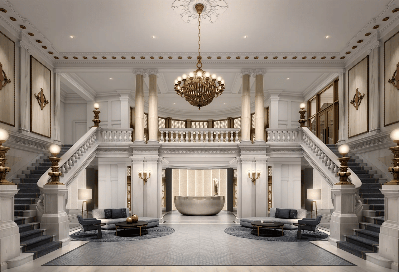 108 Leonard lobby with twin marble staircases, an ornate chandelier, and a central reception desk.