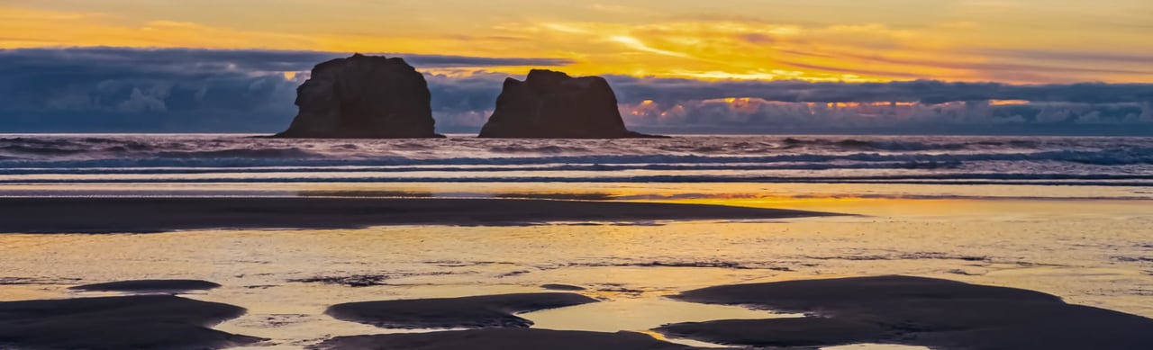 Low tide sunset with tide-pool reflections at Twin Rocks in Rockaway Oregon