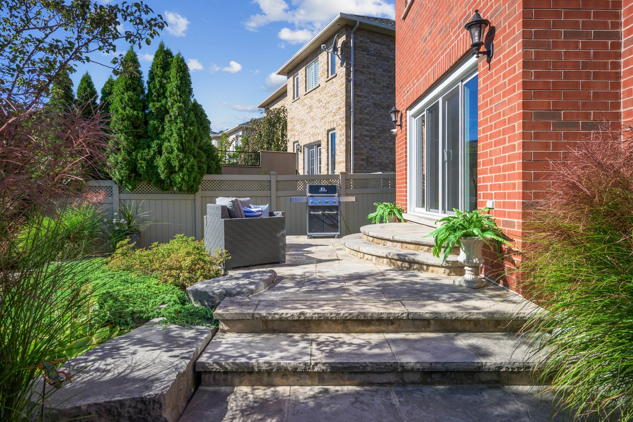 Resort-style yard backing onto lush ravine