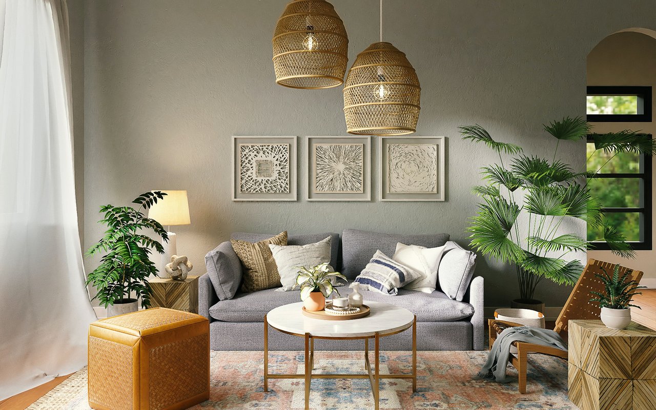 Staged living room with a gray sofa, woven pendant lights, and abundant greenery.
