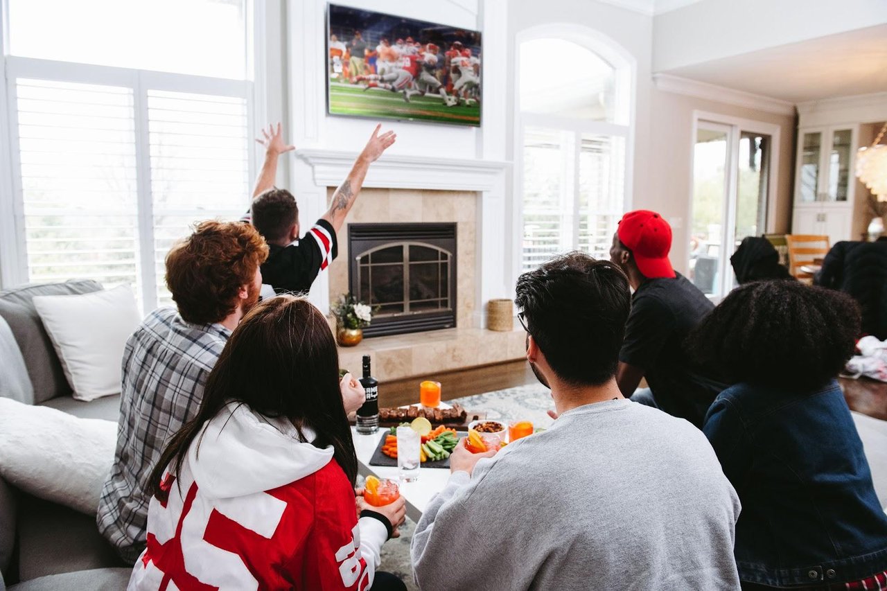 Home football watch party with wings, snacks and game-day decorations