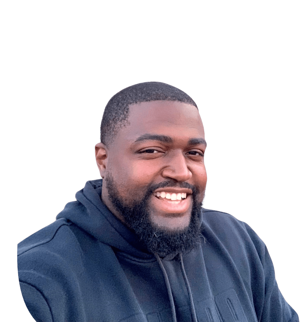 Jibril Asim Jelani Kemet smiling in a dark hoodie