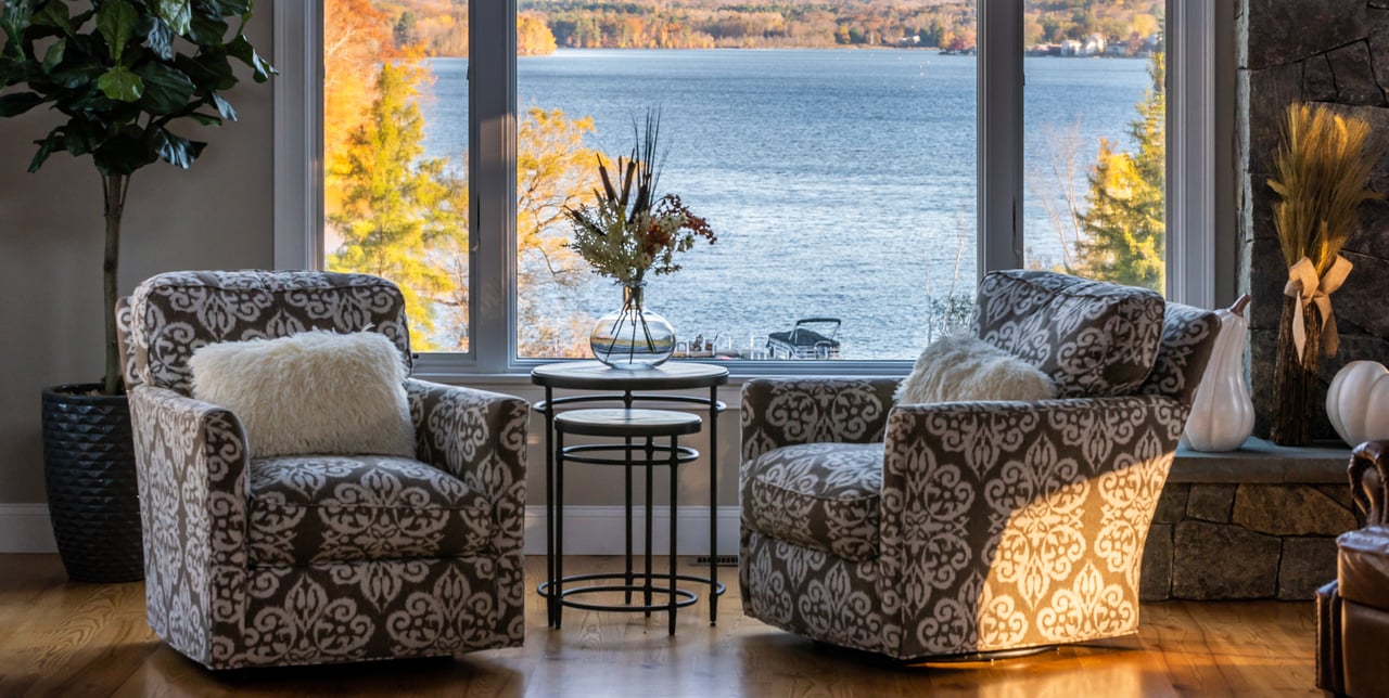 2 chairs in living room with waterfront view