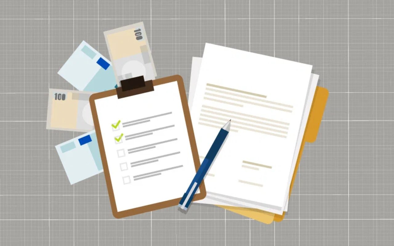 Loan application checklist and paperwork with a pencil, cards, and banknotes