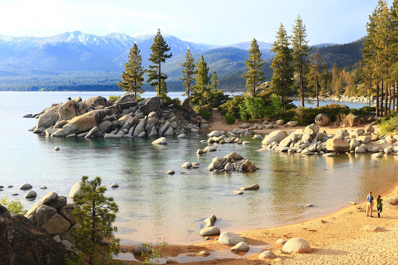Sunlit shoreline at Sand Harbor with crystal‑clear Lake Tahoe waters, inviting swims and serene late‑summer vibes.