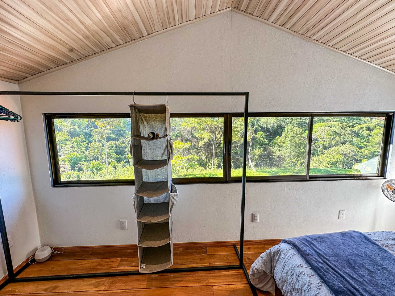 A 1-bedroom loft PERFECT for a couple or an Airbnb rental – plus a HUGE jungle backyard with a year-round river and many magical swimming holes – and a lot of flat land for further development!