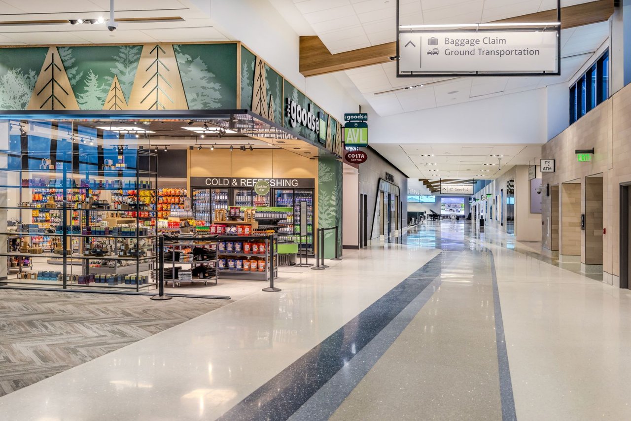 Airport shopping and traveler amenities reflecting the convenience of accessible regional travel for River Green residents.