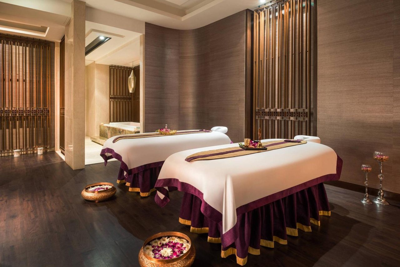 Peaceful luxury massage room with treatment beds designed for relaxation and stress relief